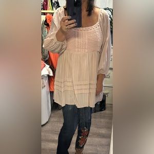 Long sleeve pink babydoll top.